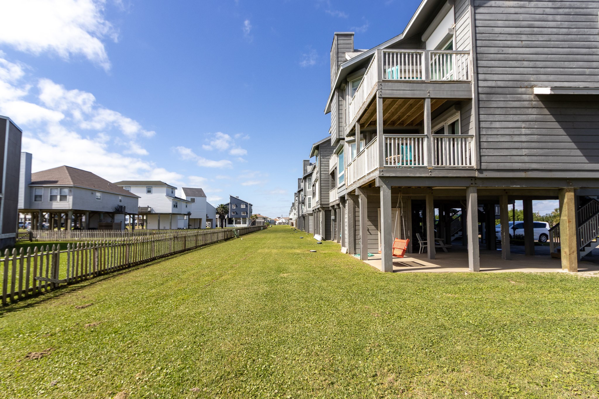 17609 Termini-San Luis Pass Road Galveston, TX 77554 - Photo 19 of 37 a view of a building with a swimming pool