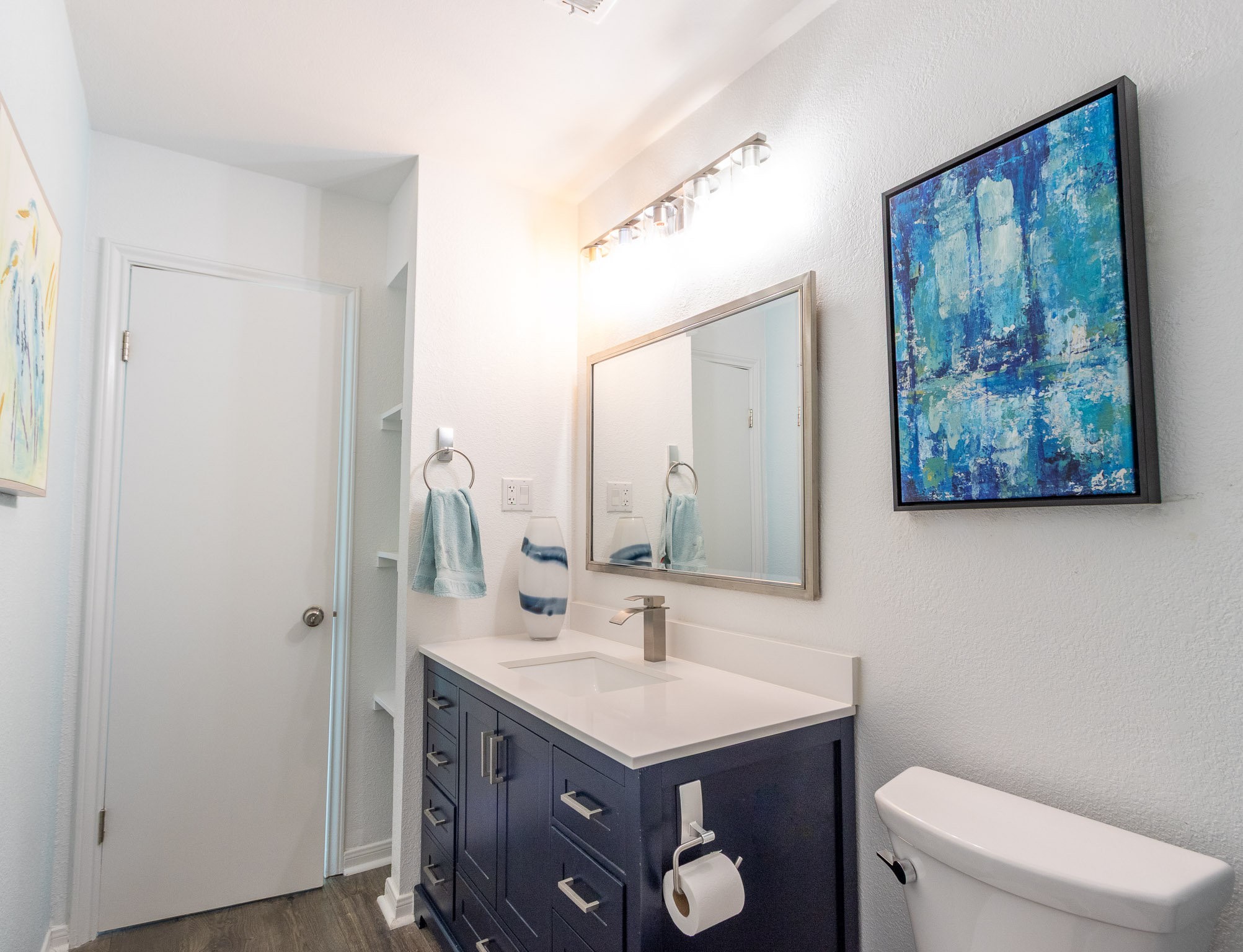 17609 Termini-San Luis Pass Road Galveston, TX 77554 - Photo 24 of 37 a bathroom with a toilet a sink and mirror