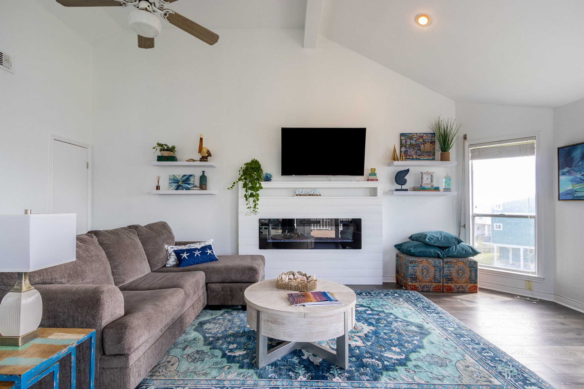 17609 Termini-San Luis Pass Road Galveston, TX 77554 - Photo 28 of 37 a living room with furniture and a flat screen tv