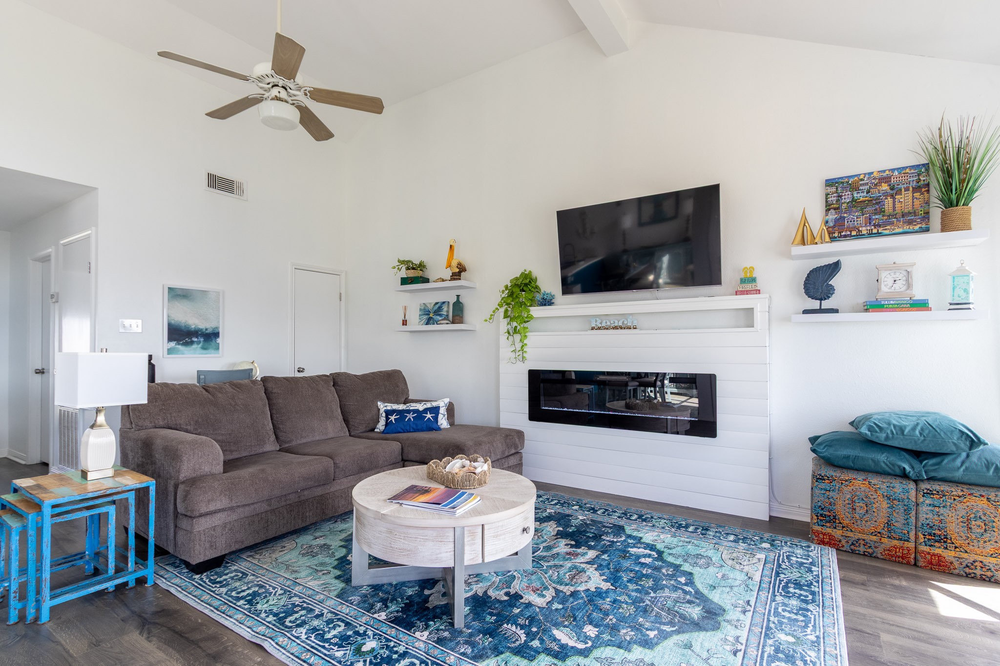 17609 Termini-San Luis Pass Road Galveston, TX 77554 - Photo 29 of 37 a living room with furniture a flat screen tv and a fireplace