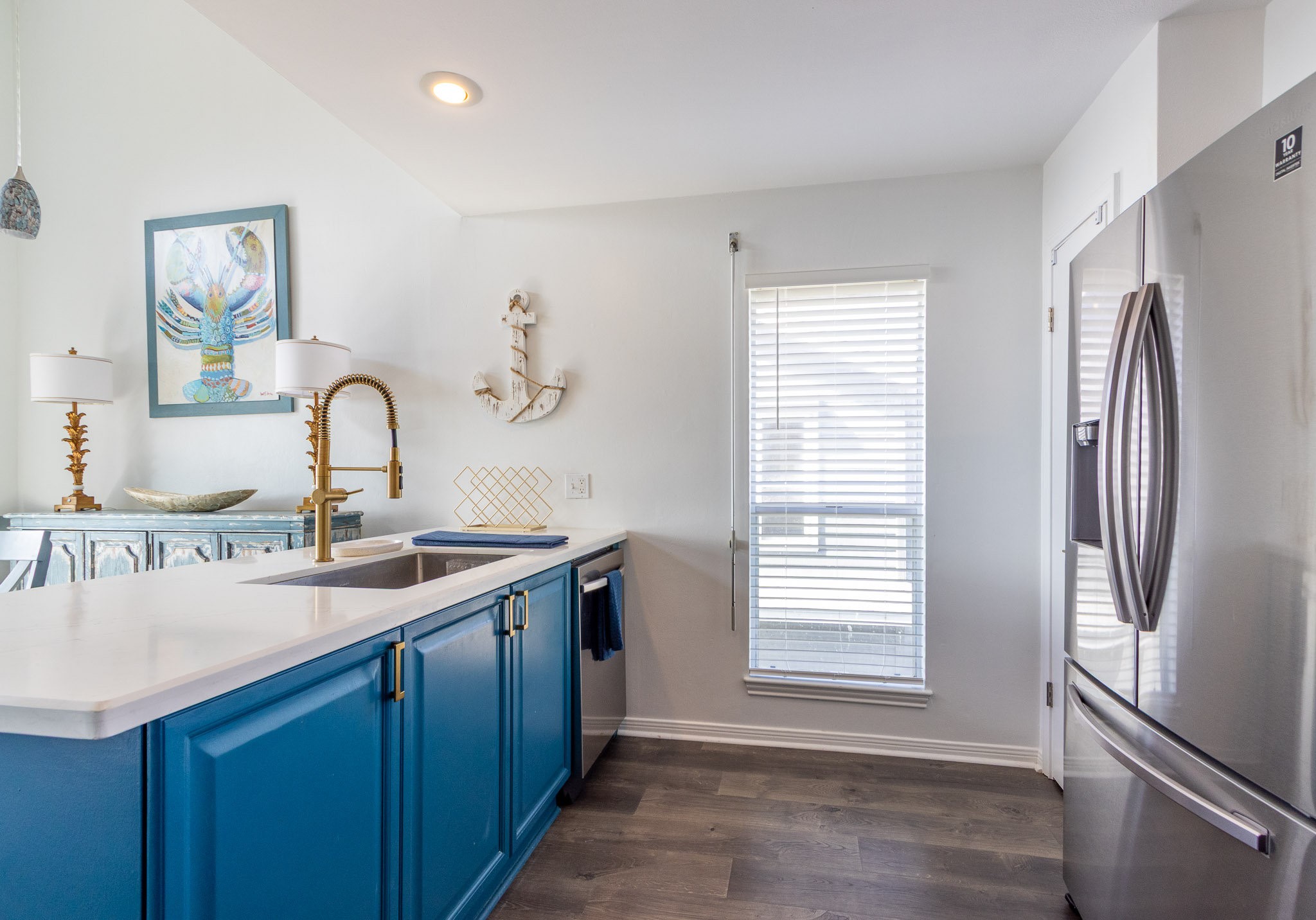 17609 Termini-San Luis Pass Road Galveston, TX 77554 - Photo 31 of 37 a kitchen with a refrigerator and a sink