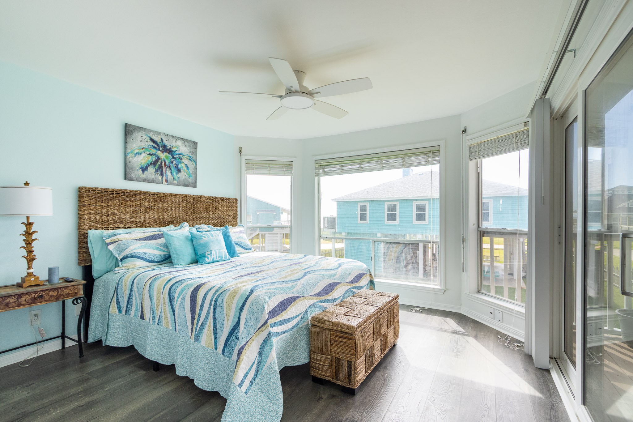 17609 Termini-San Luis Pass Road Galveston, TX 77554 - Photo 5 of 37 a bedroom with a large bed and a large window