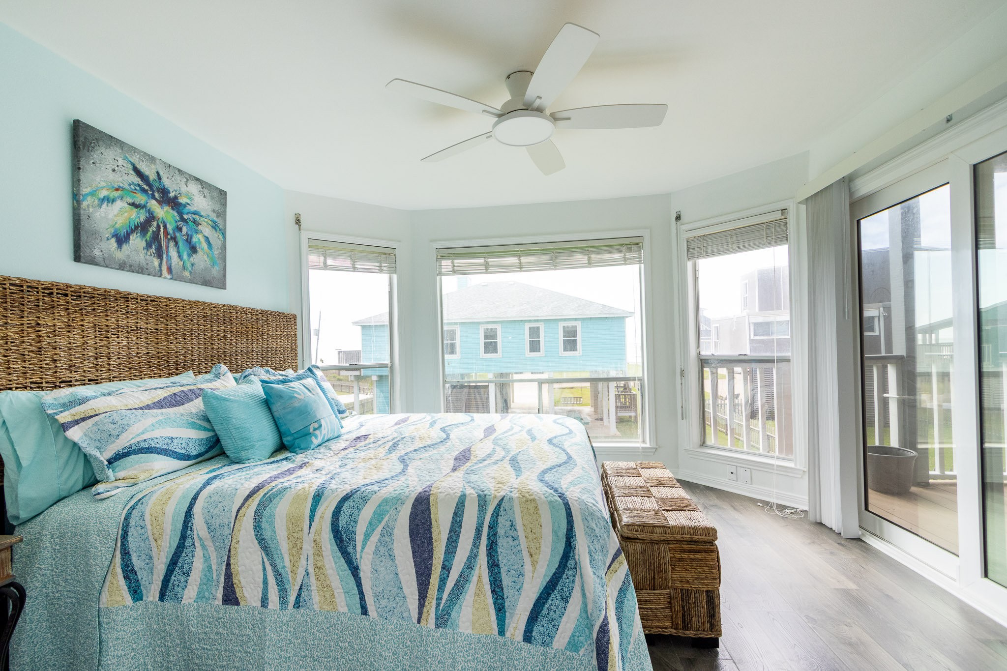 17609 Termini-San Luis Pass Road Galveston, TX 77554 - Photo 7 of 37 a bedroom with a balcony a bed and a large window
