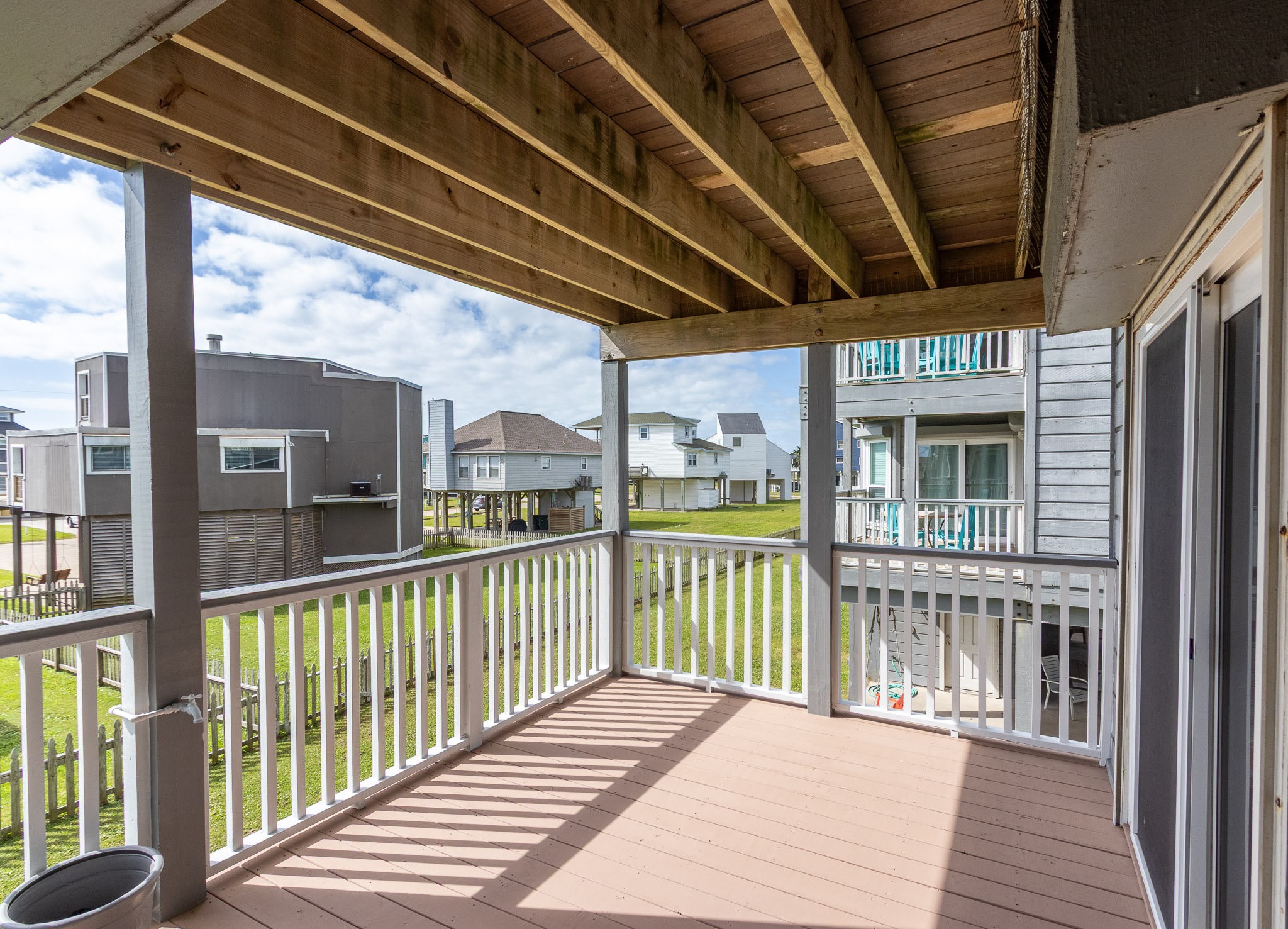 17609 Termini-San Luis Pass Road Galveston, TX 77554 - Photo 9 of 37 a view of a balcony with wooden floor