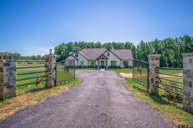 a aerial view of a house with a yard