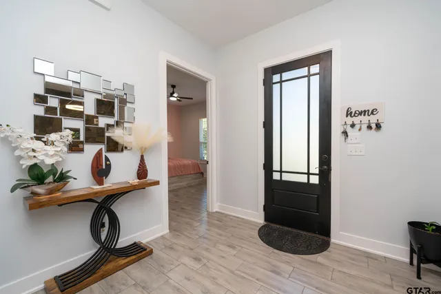 a large bathroom with a double vanity sink a mirror and a bathtub