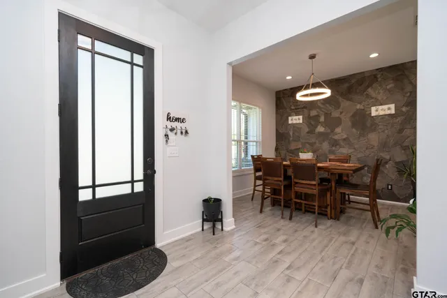 a bathroom with a bathtub sink and mirror