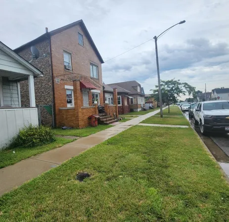 a house view with a play ground in front of it