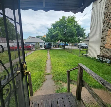 a view of a backyard with potted plants