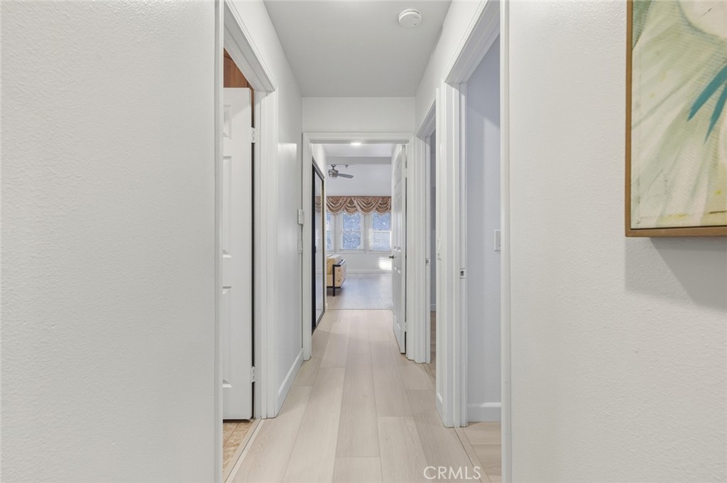 21465 Running Branch Road Diamond Bar, CA 91765 - Photo 19 of 47 a view of a hallway with wooden floor and a bathroom