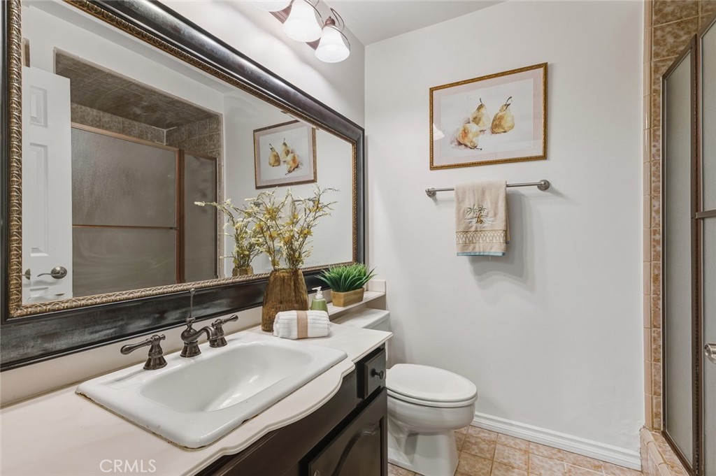 21465 Running Branch Road Diamond Bar, CA 91765 - Photo 20 of 47 a bathroom with a sink toilet and mirror