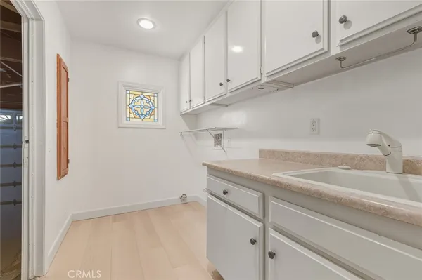 a kitchen with a sink and cabinets