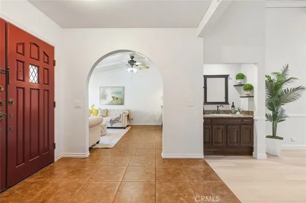 a living room with furniture rug and window