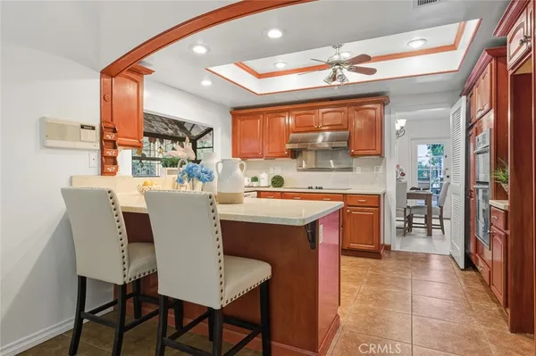 a kitchen with stainless steel appliances granite countertop a sink and cabinets