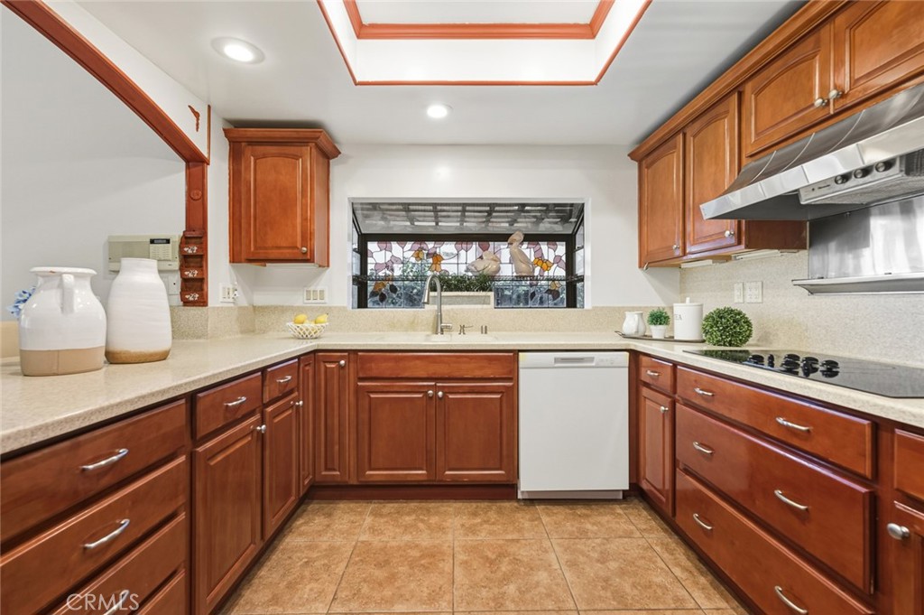 21465 Running Branch Road Diamond Bar, CA 91765 - Photo 39 of 47 a kitchen with stainless steel appliances granite countertop a sink and cabinets