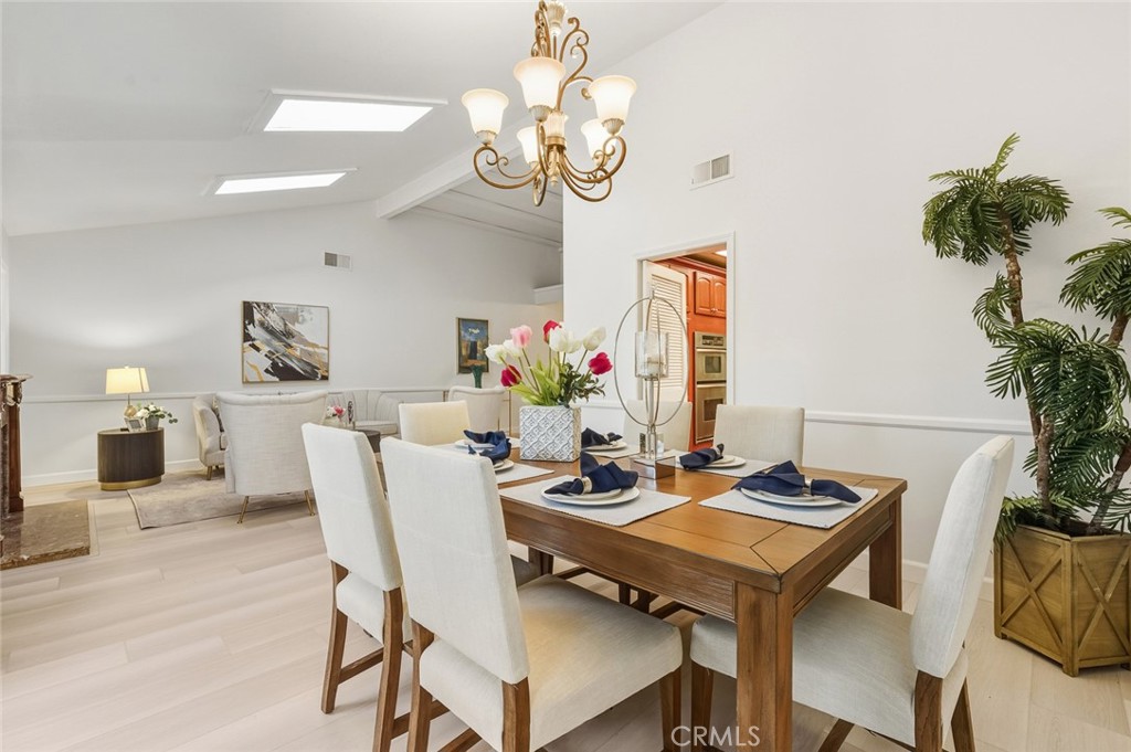21465 Running Branch Road Diamond Bar, CA 91765 - Photo 43 of 47 a view of a dining room with furniture and chandelier
