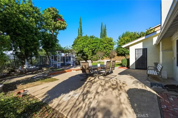 a view of a backyard with sitting area