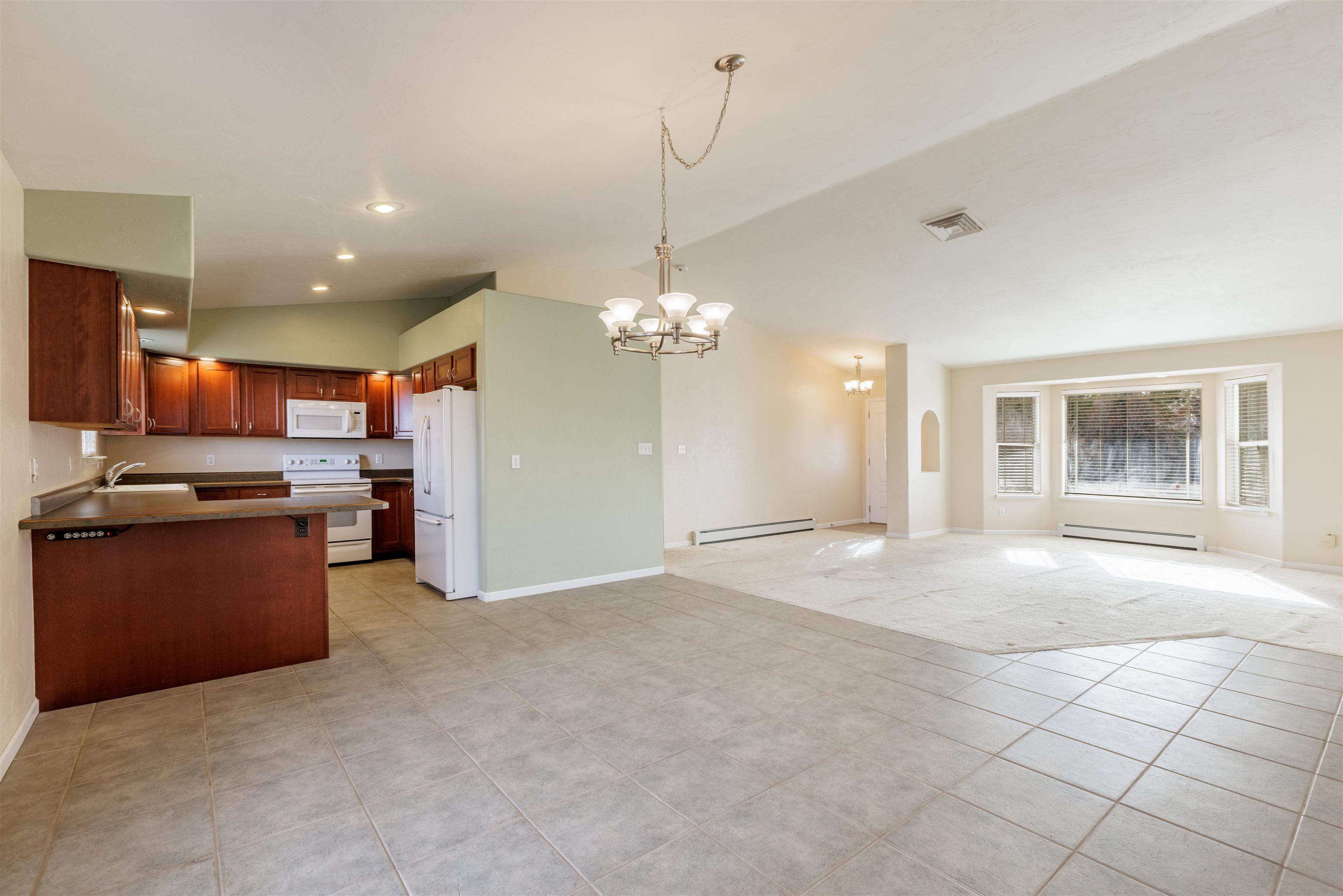 2098 J Road Fruita, CO 81521 - Photo 3 of 13 a view of a kitchen with a sink and microwave