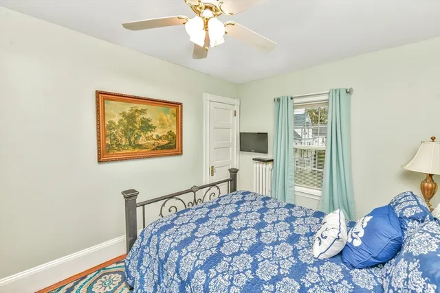 a view of a dining room with a chandelier and wooden floor