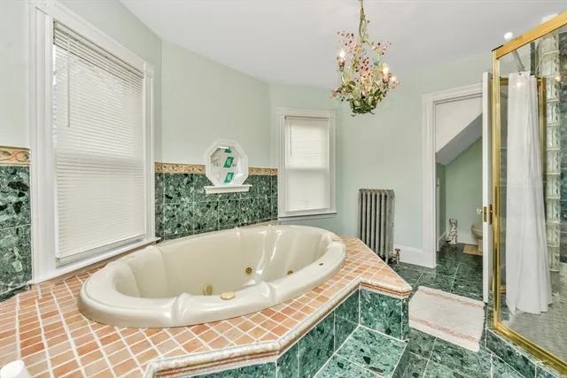 a kitchen with stainless steel appliances granite countertop a refrigerator and a stove