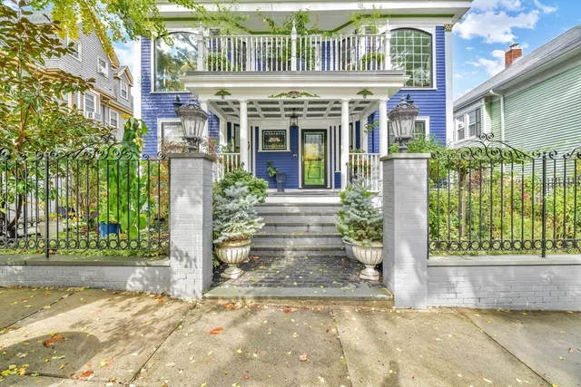 a front view of a building with garden