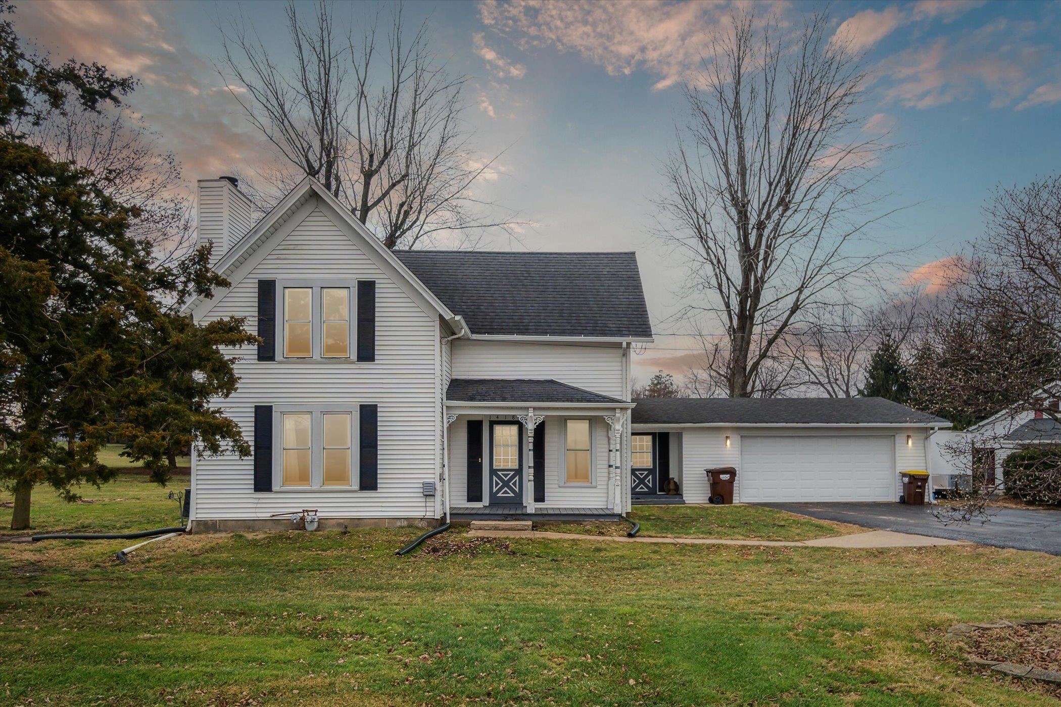 14188 Beloit Road Caledonia, IL 61011 - Photo 1 of 42 a front view of a house with a garden