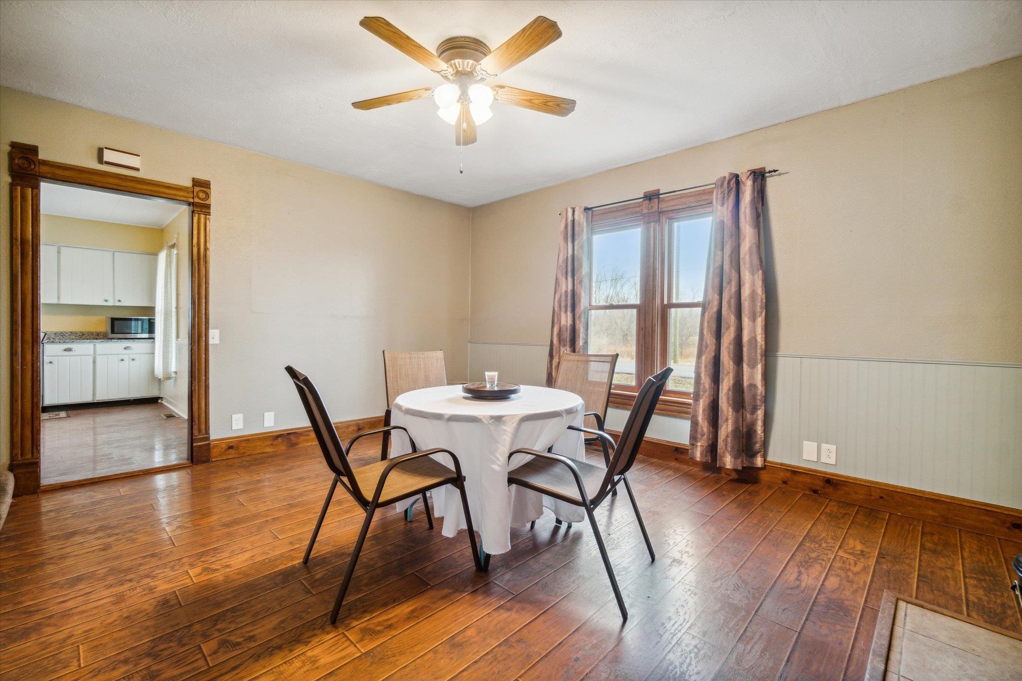 14188 Beloit Road Caledonia, IL 61011 - Photo 11 of 42 a view of a dining room with furniture and wooden floor