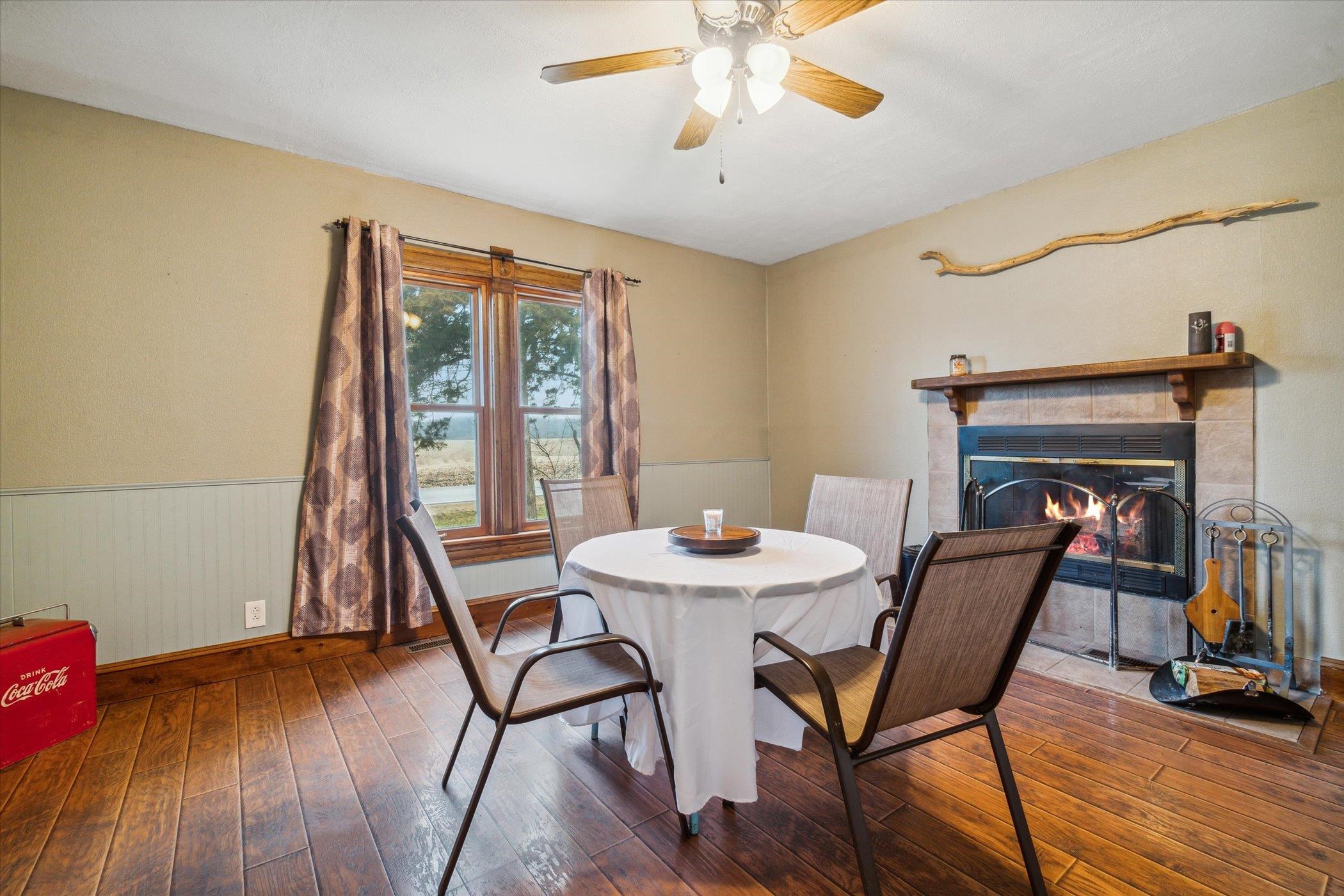 14188 Beloit Road Caledonia, IL 61011 - Photo 12 of 42 a view of a dining room with furniture window and wooden floor