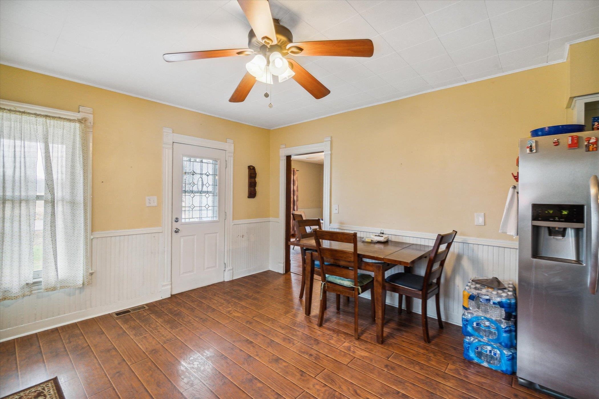 14188 Beloit Road Caledonia, IL 61011 - Photo 15 of 42 a view of a dining room with furniture and wooden floor