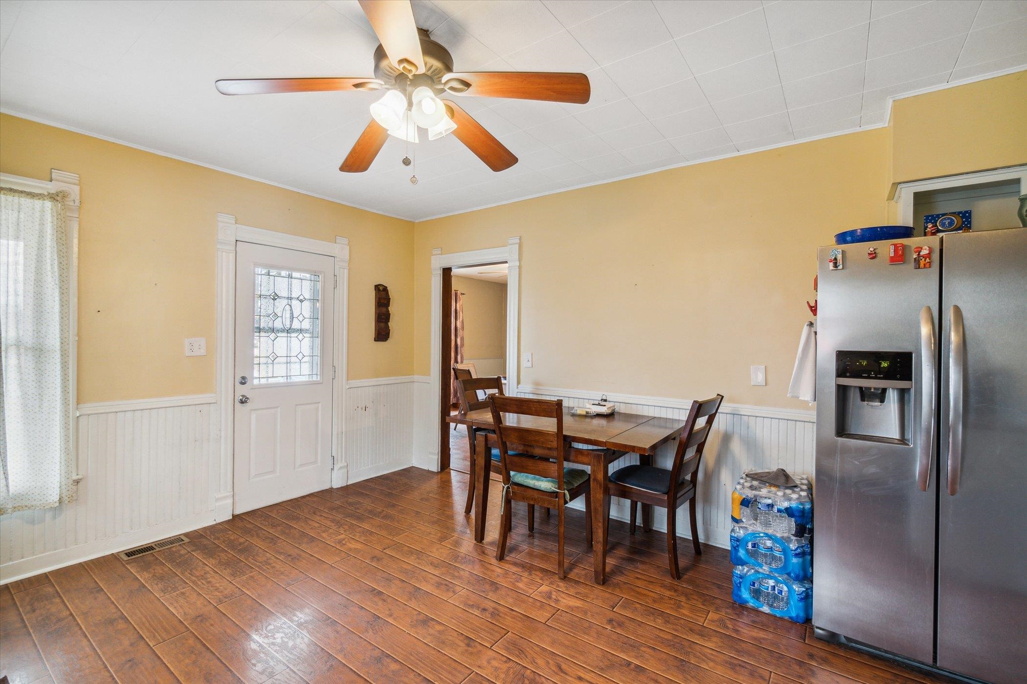 14188 Beloit Road Caledonia, IL 61011 - Photo 16 of 42 a view of a dining room with furniture window and wooden floor