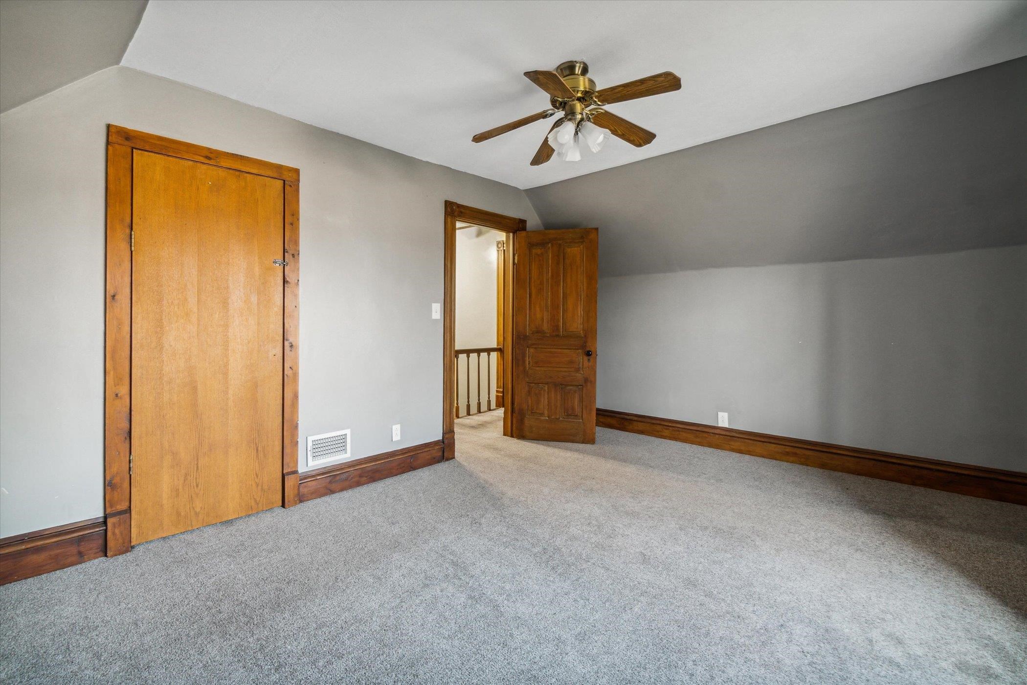 14188 Beloit Road Caledonia, IL 61011 - Photo 25 of 42 an empty room with window and ceiling fan