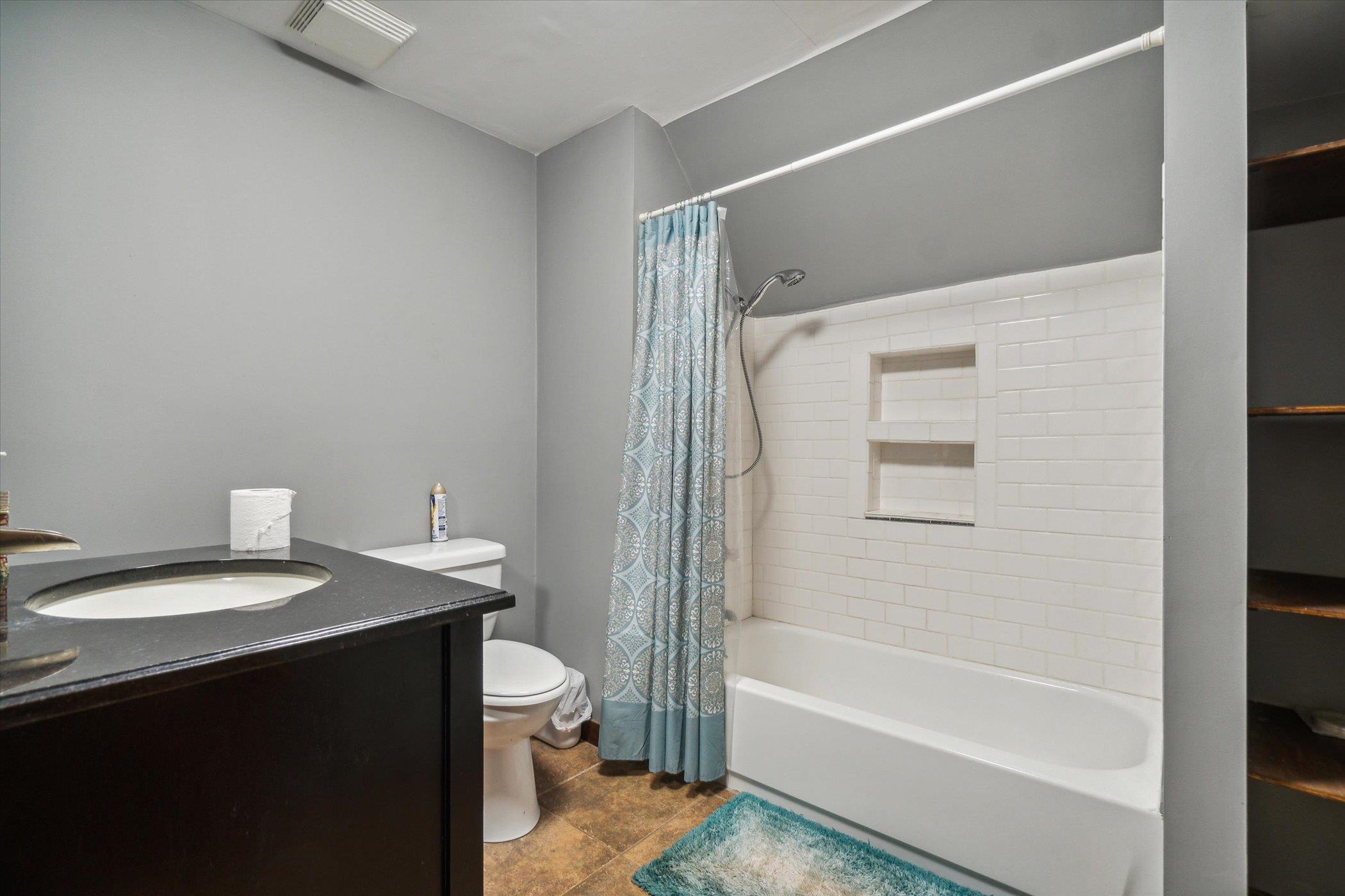 14188 Beloit Road Caledonia, IL 61011 - Photo 27 of 42 a bathroom with a sink a toilet and shower