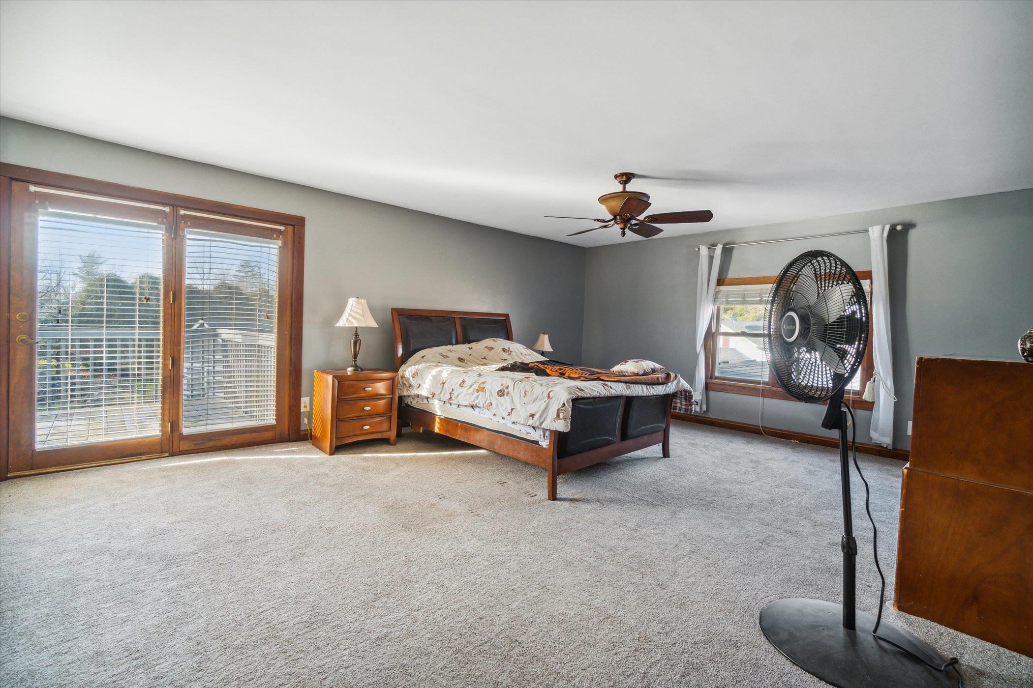 14188 Beloit Road Caledonia, IL 61011 - Photo 28 of 42 a bedroom with bed and a large window