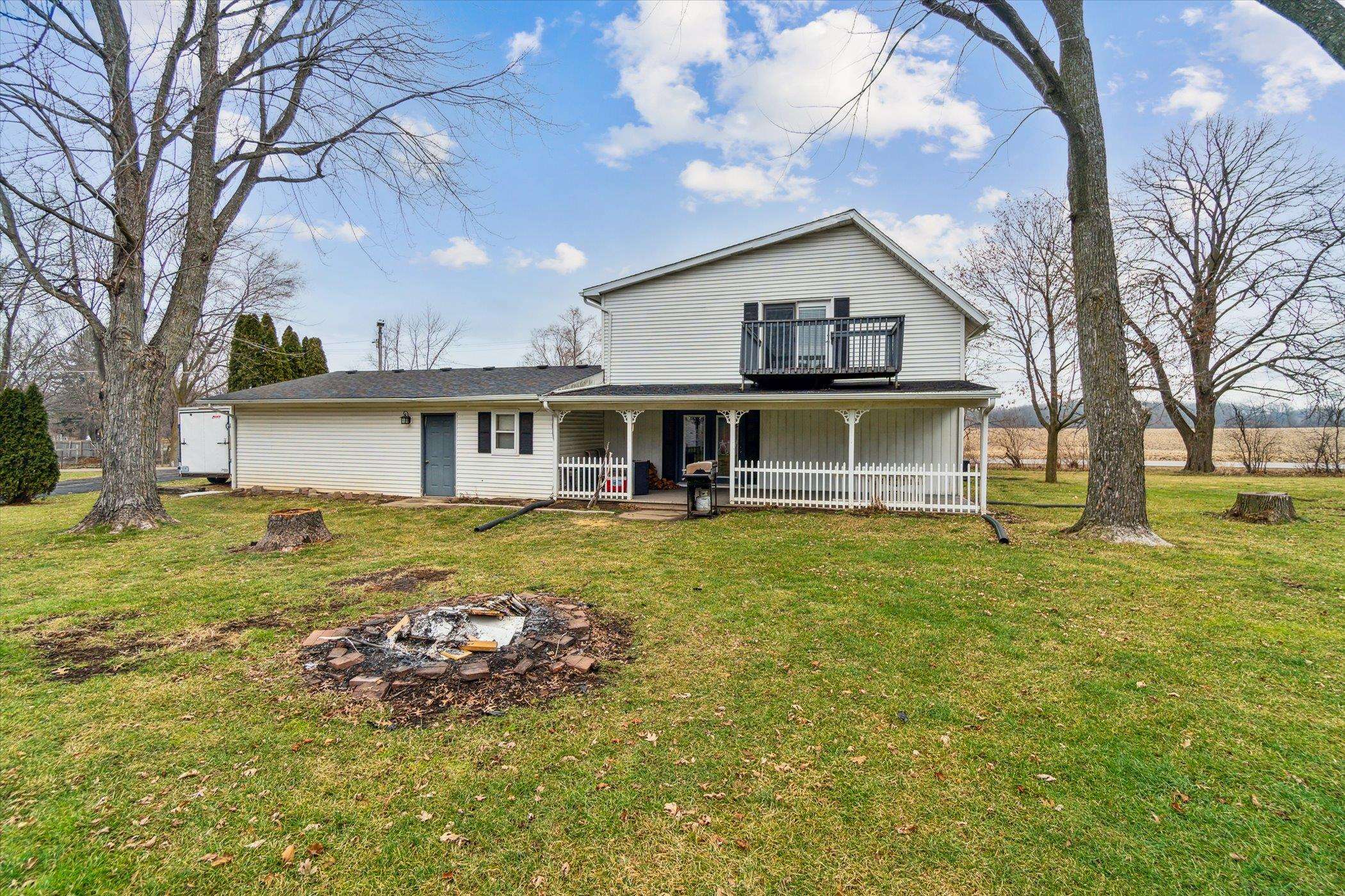 14188 Beloit Road Caledonia, IL 61011 - Photo 41 of 42 a front view of a house with a garden