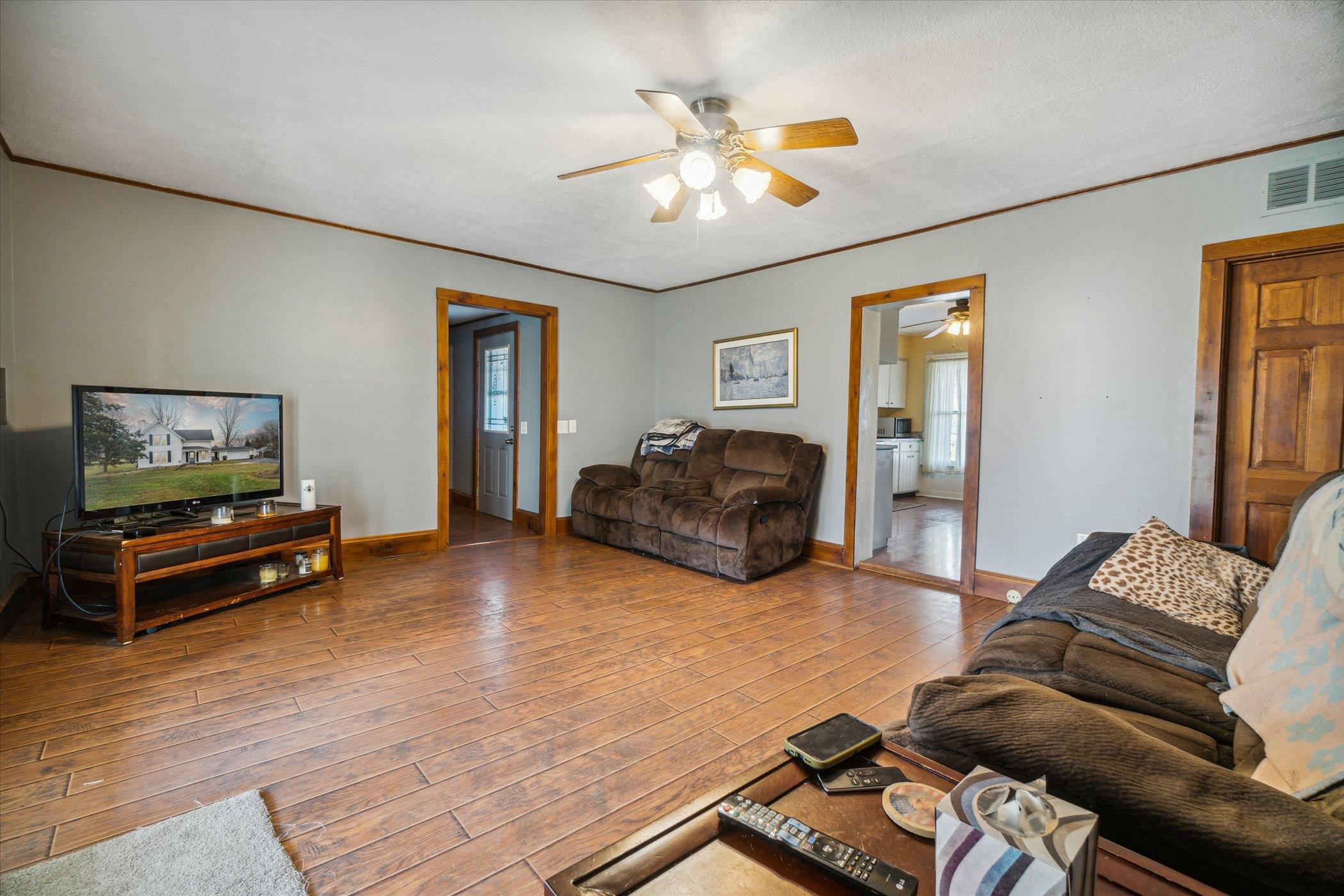14188 Beloit Road Caledonia, IL 61011 - Photo 9 of 42 a living room with furniture and a flat screen tv