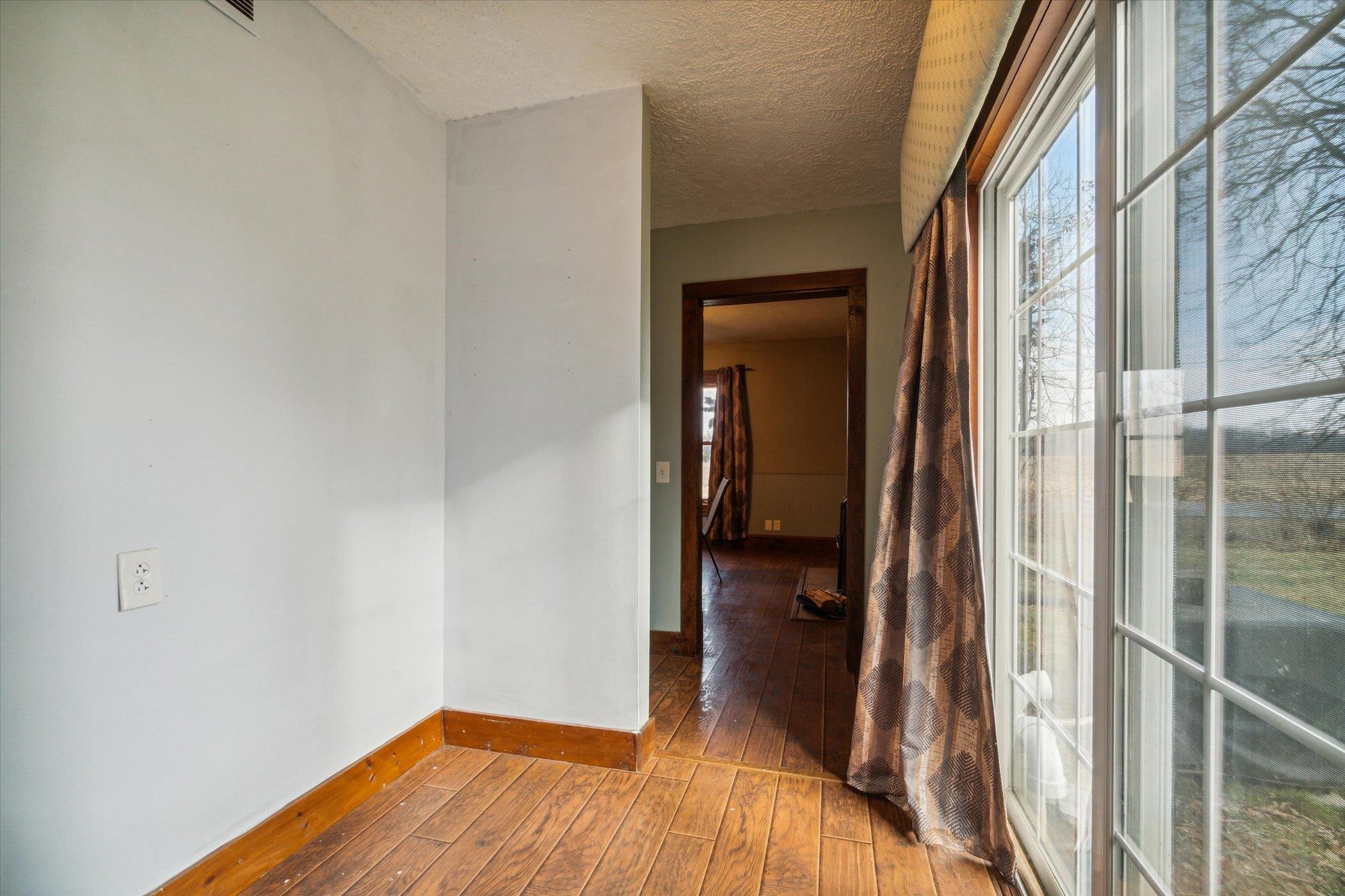 14188 Beloit Road Caledonia, IL 61011 - Photo 10 of 42 a view of a bedroom from a hallway