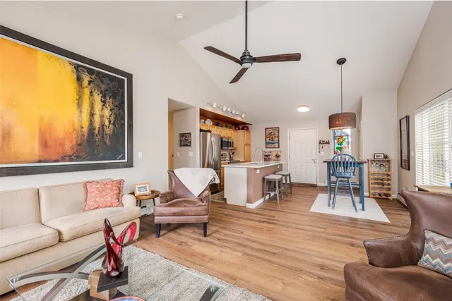 a living room with furniture a window and appliances