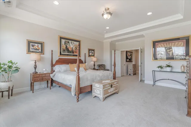 a bathroom with a granite countertop tub sink and large mirror