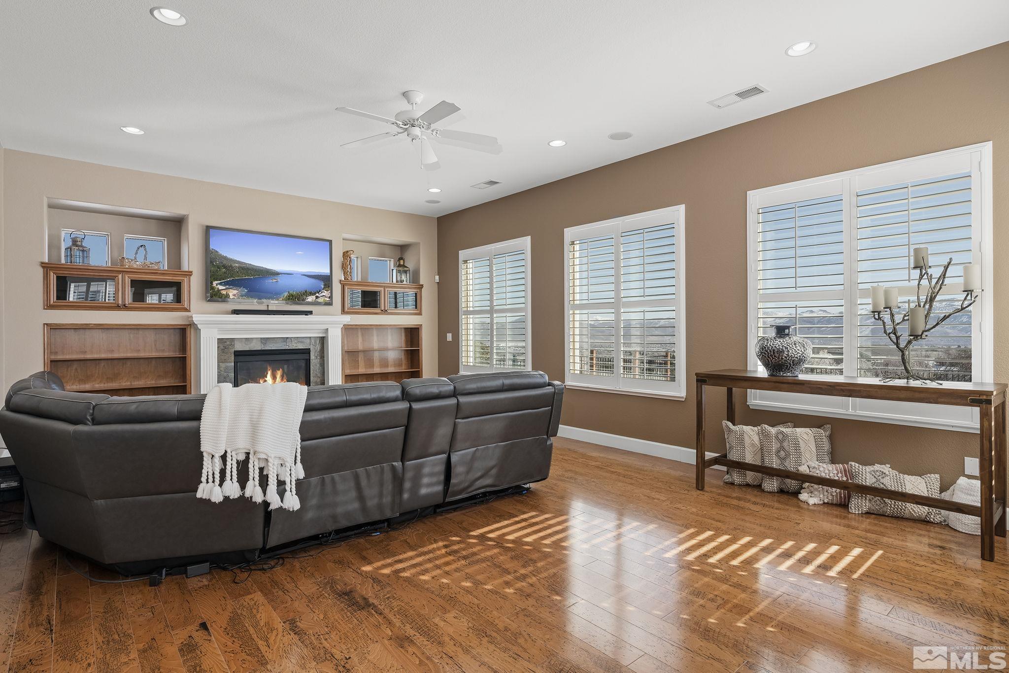 6982 Peacepipe Court Reno, NV 89511 - Photo 11 of 28 a living room with furniture and a fireplace