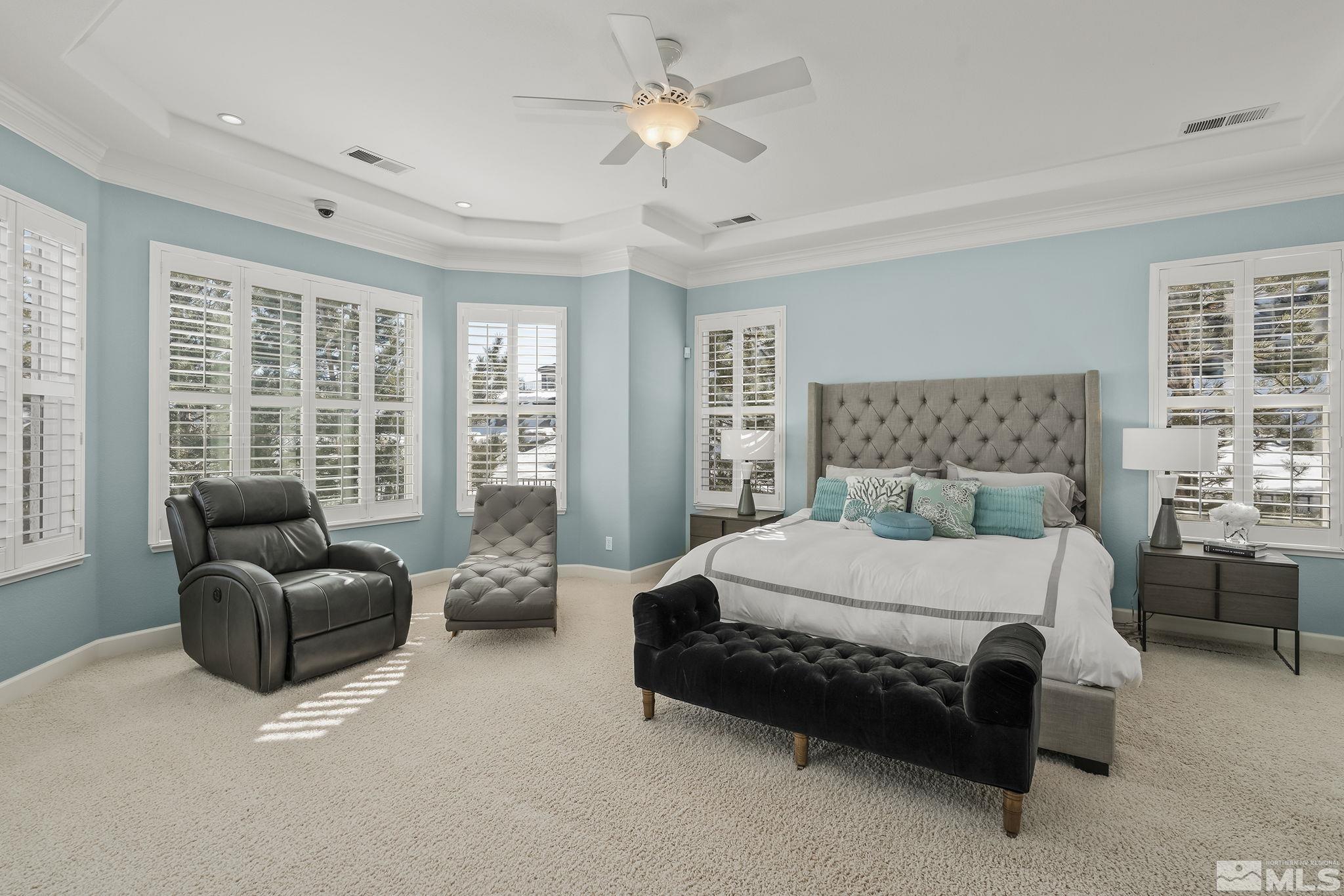 6982 Peacepipe Court Reno, NV 89511 - Photo 14 of 28 a bedroom with a bed couch and window