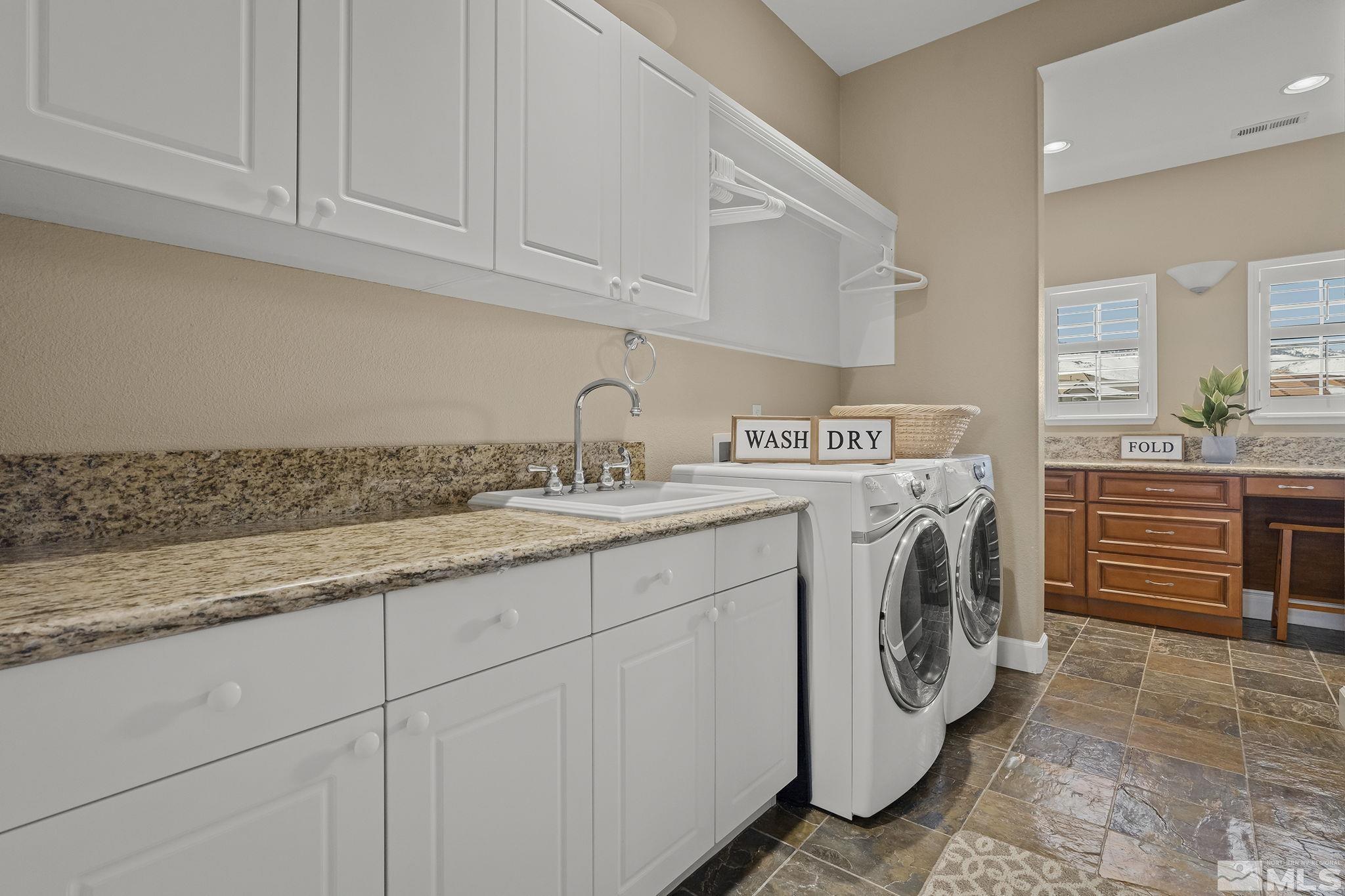 6982 Peacepipe Court Reno, NV 89511 - Photo 21 of 28 a utility room with dryer and washer
