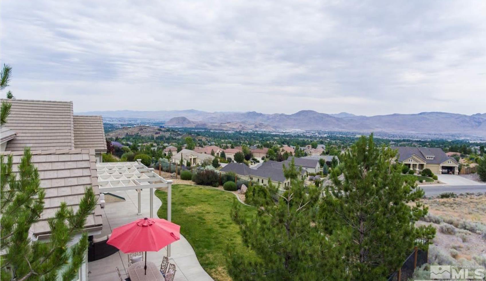 6982 Peacepipe Court Reno, NV 89511 - Photo 23 of 28 an aerial view of a house with mountain view