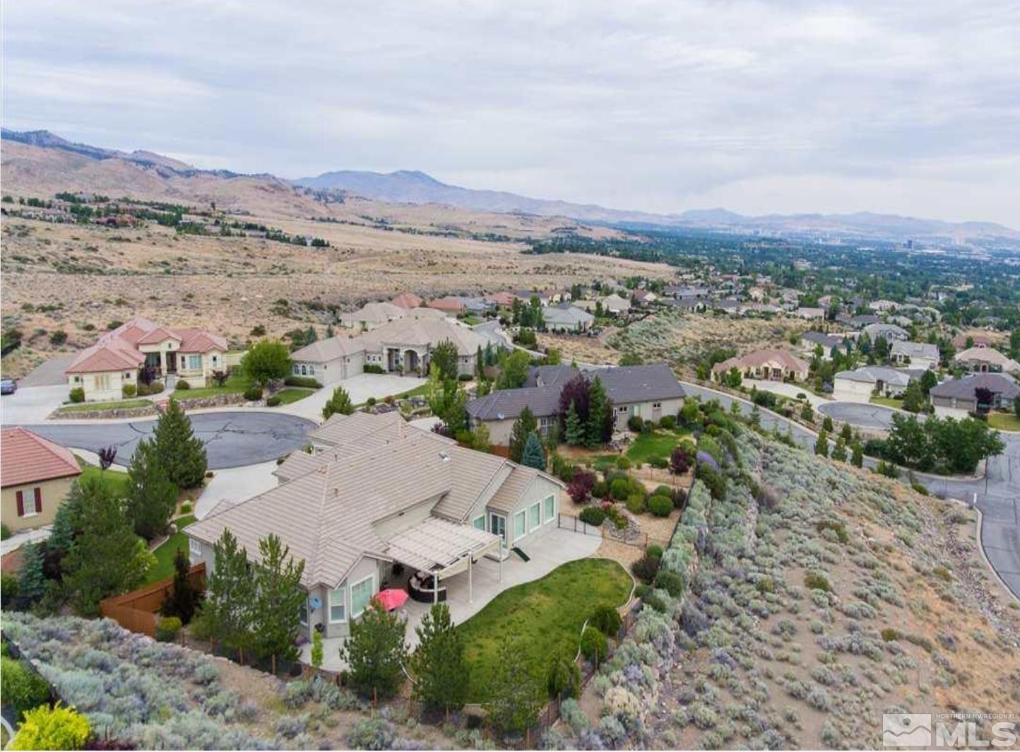 6982 Peacepipe Court Reno, NV 89511 - Photo 25 of 28 an aerial view of residential houses with outdoor space and street view