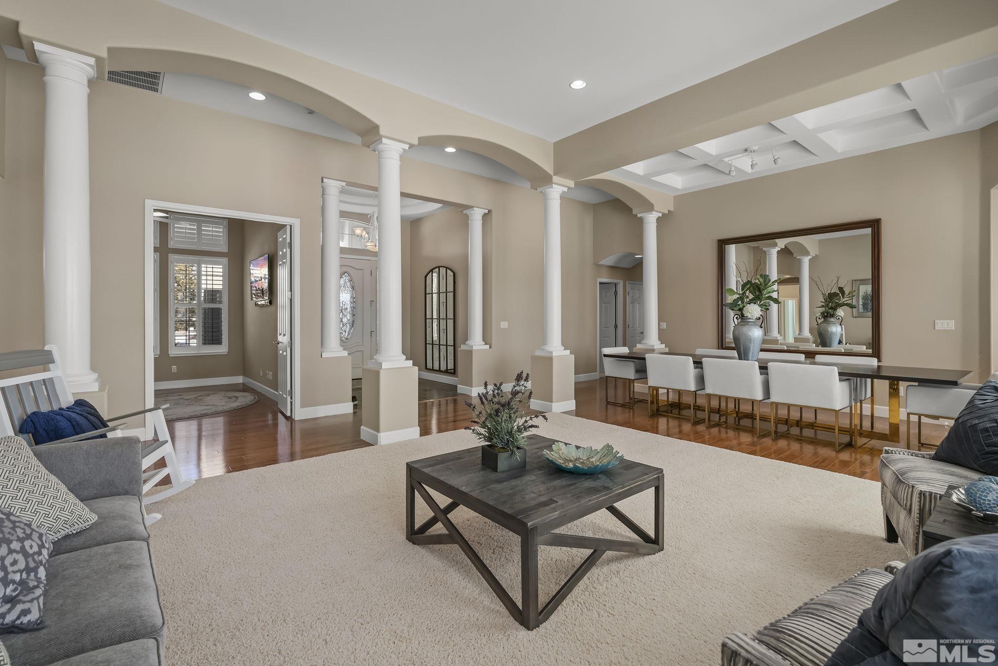 6982 Peacepipe Court Reno, NV 89511 - Photo 3 of 28 a living room with furniture and a table