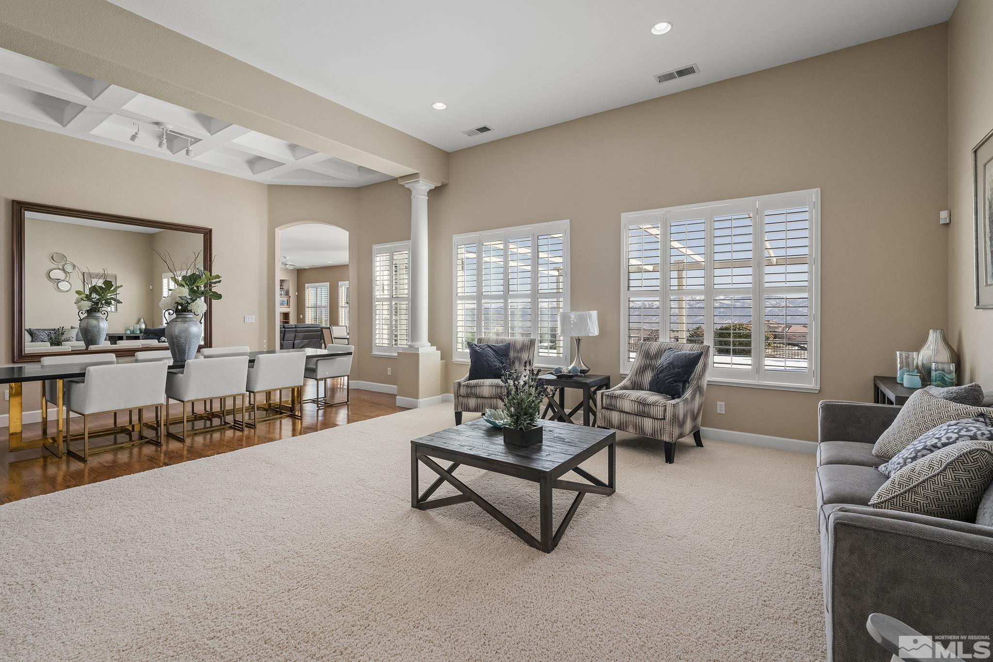 6982 Peacepipe Court Reno, NV 89511 - Photo 4 of 28 a living room with furniture and a large window
