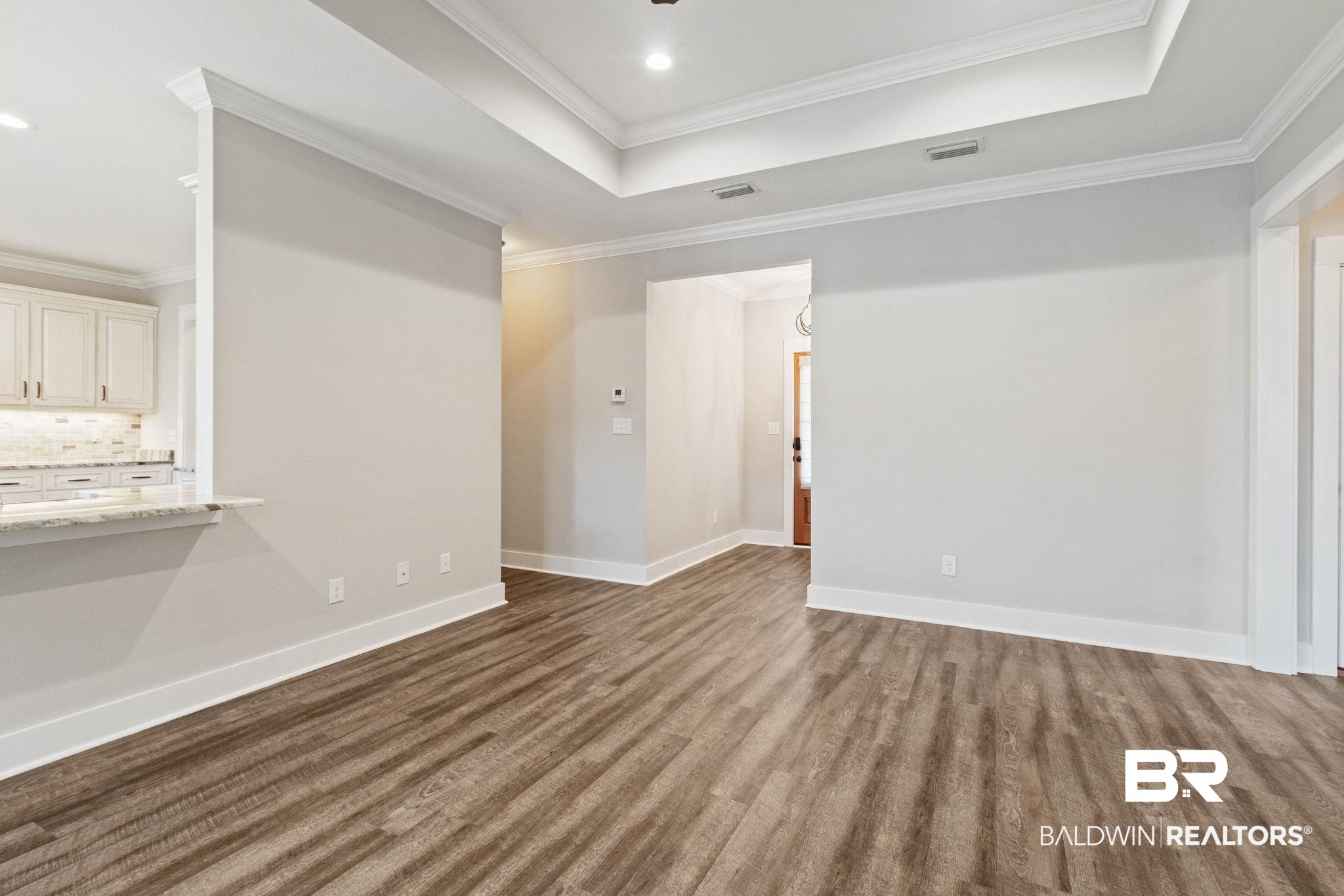 17376 Bankhead Boulevard Fairhope, AL 36532 - Photo 15 of 73 Unfurnished room with dark wood-style floors and crown molding