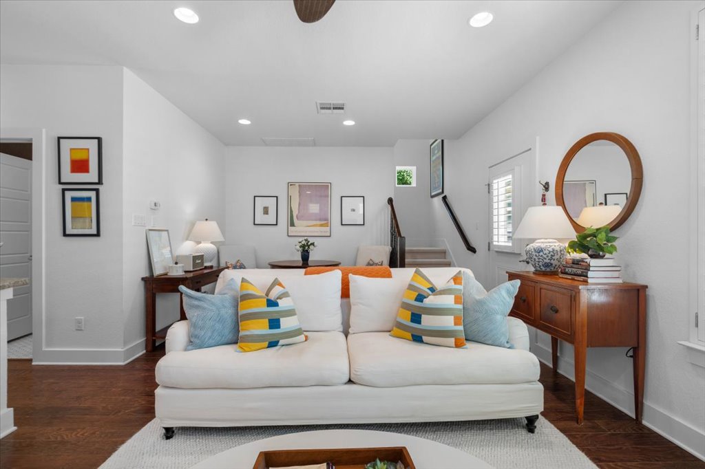 12200 Tawny Farms Road, Unit 139 Austin, TX 78748 - Photo 9 of 30 Look just how spacious and versatile the main level is. Behind the sofa, there’s plenty of space for a secondary seating nook or a small dining bistro set near the stairs.