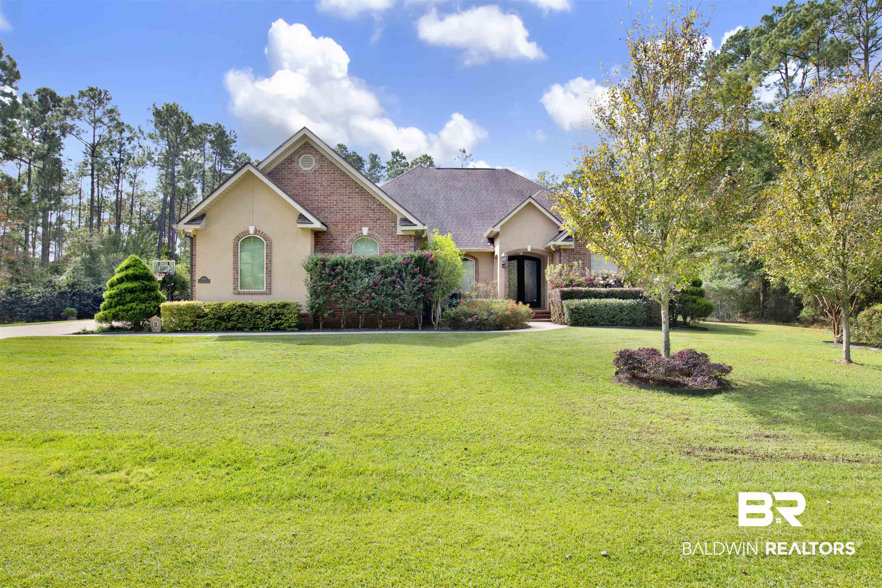 18360 Treasure Oaks Road Gulf Shores, AL 36542 - Photo 57 of 57 View of front of home featuring a front lawn