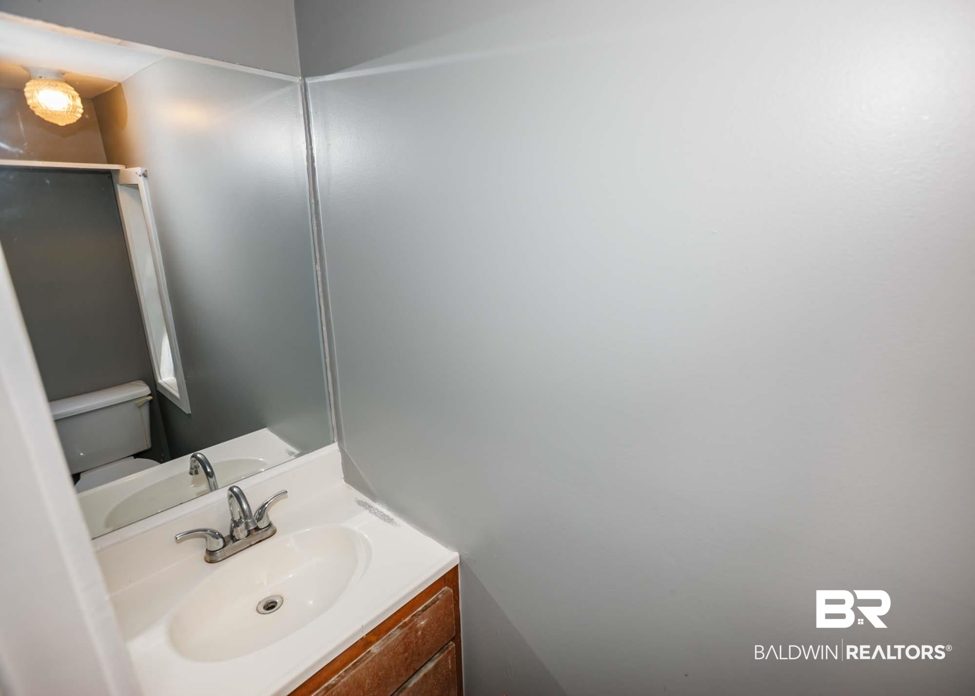 11998 Workman Avenue Foley, AL 36535 - Photo 48 of 59 Bathroom with toilet and vanity