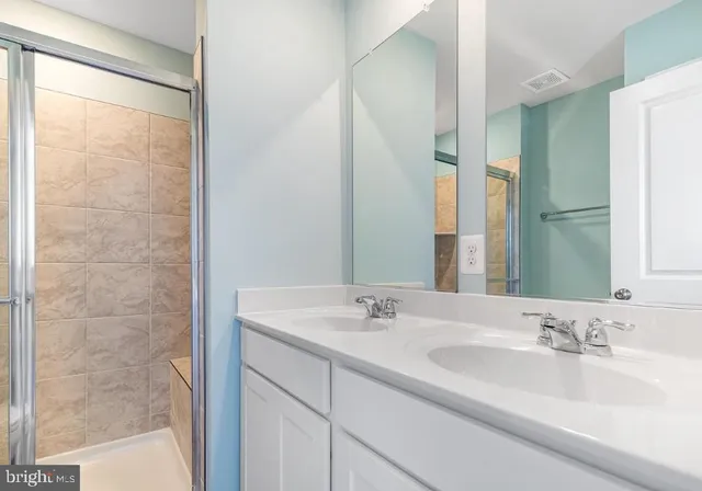 a bathroom with a shower a toilet and a shower